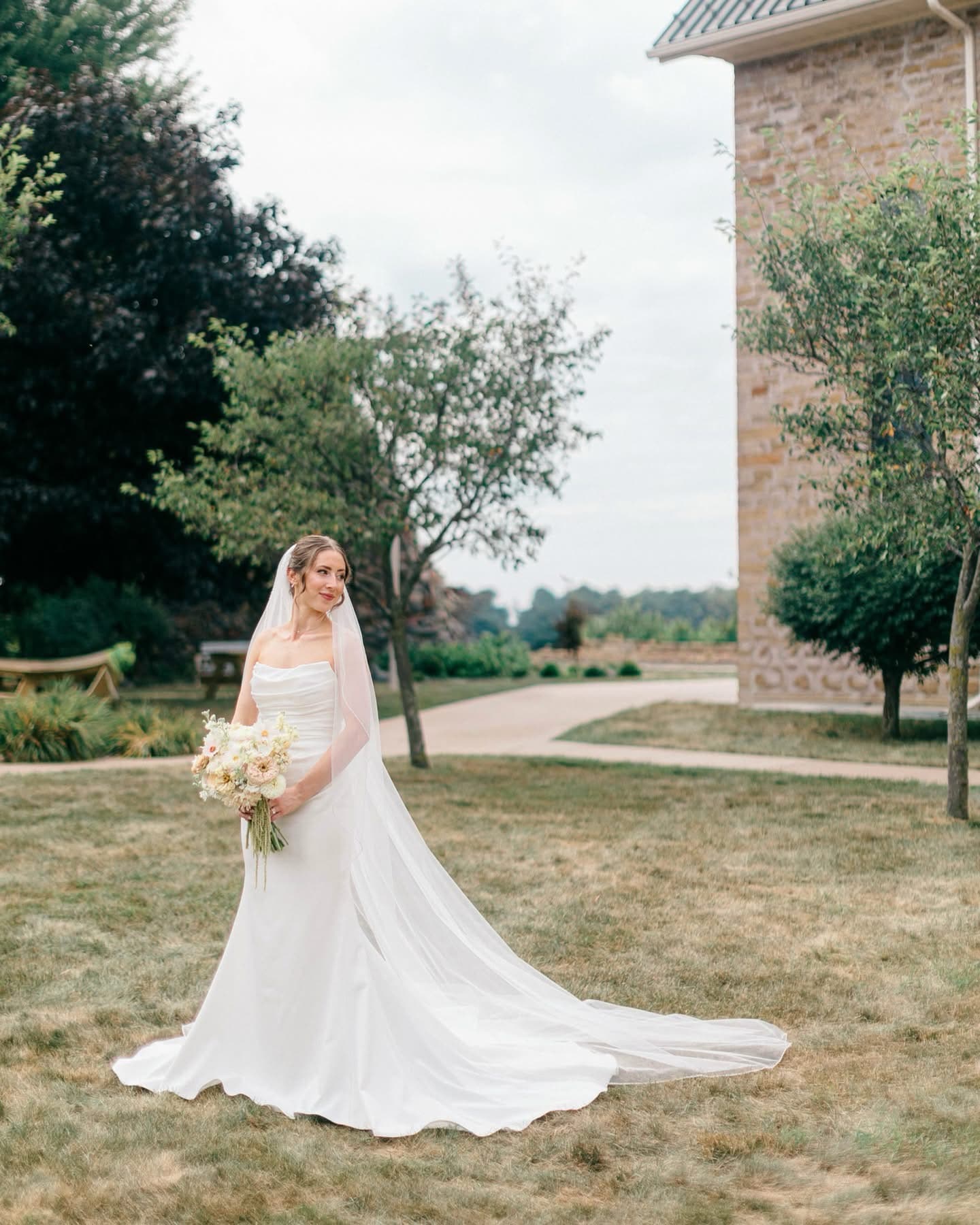 Bride portrait in front of a stone building